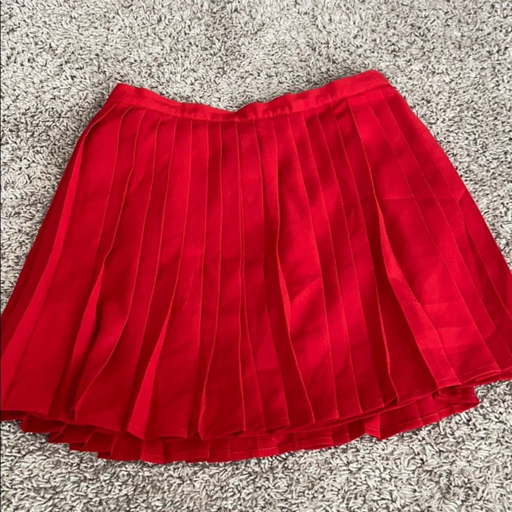 red pleated skirt